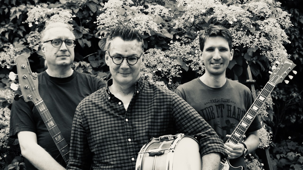 Three Musicians with bass, drum and guitar